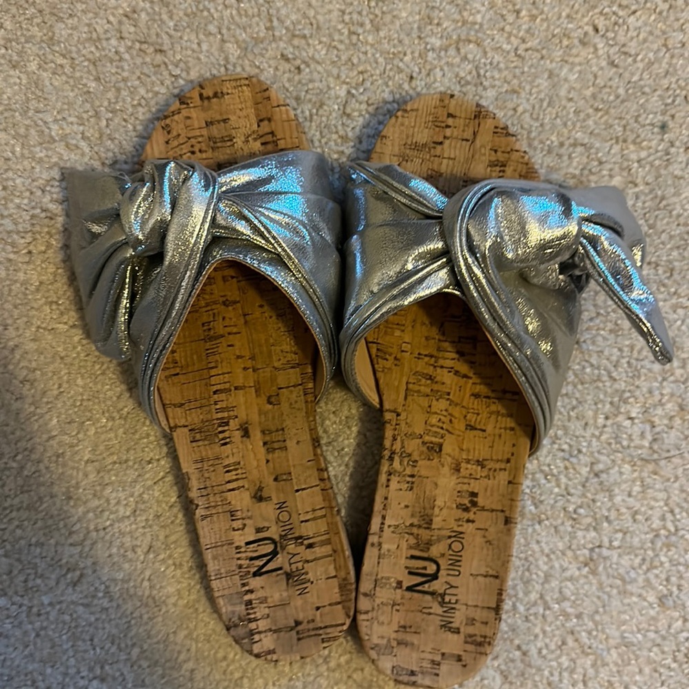 Never worn! Adorable silver bow sandals.